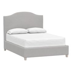 a bed with white linens and pillows on top of the headboard, in front of a white background