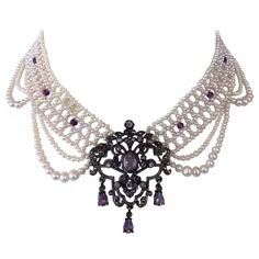 Gorgeous One of One Necklace by Marina J. This piece features a Vintage Victorian Inspired Silver Brooch with Amethyst and Crystal set within, reimagined into a stunning Centerpiece. The Centerpiece gives amazing shine and is attached to a Cultured Pearl band which is intricately woven into a Lace like design. Faceted Amethysts adorn the center of the Pearl band, as dramatic Draped Pearls embellish this necklace. This Statement One of A Kind Necklace measures 16 inches long, and meets at a decor Purple Statement Necklace, Victorian Accessories, Silver Centerpiece, Czech Glass Necklace, Princess Jewelry, Big Necklace, One Of One, Amethyst Jewelry, Crystal Set