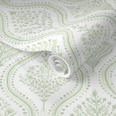 a green and white wallpaper with floral designs