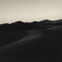 black and white photograph of sand dunes in the desert