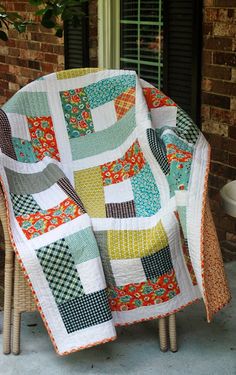 a quilted chair sitting on top of a patio