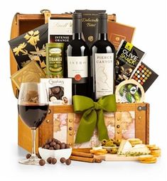 a wine gift basket with two bottles of wine and snacks