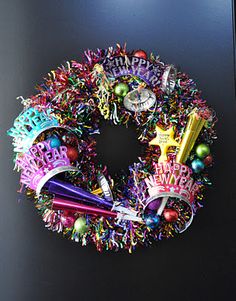 a christmas wreath is hanging on the door with decorations around it and an assortment of confetti