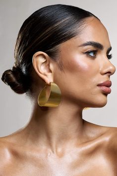 Looking for hoops that make a statement? Mercury will do just that. Defined by its chunky design and ribbed detailing, keep Mercury at the forefront with a sleek bun to give these earrings the attention they deserve. Features - Gold toned- Chunky hoop design- Ribbed finish- Hinge fasteningProduct Information Designed exclusively by Club L LondonGold-toned brass (100% Brass)SKU: CL134284007 Returns InformationEarrings and pierced jewellery cannot be returned for health and hygiene reasons. Health And Hygiene, I Love Gold, Club L London, Abstract Earrings, Chunky Hoop Earrings, Heart Dangle Earrings, Statement Drop Earrings, Pierced Jewelry, Oval Earring