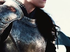 a close up of a person wearing armor