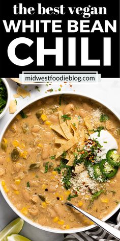 the best vegan white bean chili in a bowl with tortilla chips and cilantro