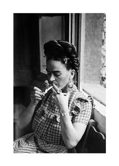 an old photo of a woman brushing her teeth