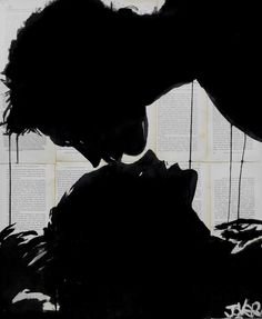 the silhouette of two people kissing in front of an open book