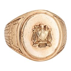 Finely detailed antique Victorian family crest signet ring (circa 1898), crafted in 10 karat yellow gold. The oval signet mount features a family crest with the year '1898' to the base. The side shoulders feature a pretty etched foliate design. The low rise ring (3.5mm - 0.13 inches) sits comfortably on the finger. The ring is in good condition with some wear evident. We have not cleaned it in order to preserve patina and collector value. Particulars: Weight: 13.5 grams Stones: N/A Size & Measurements: The ring is a size 8 1/2 (not sizable). The mount measures 18mm in length (0.70 inches) and 14mm wide (0.55 inches) rising 3.5mm from the finger. Metal & Hallmark: 10 karat yellow gold. The ring is not hallmarked though it has tested positive for 10k gold. Family Crest Rings, Golden Key, Gold Signet Ring, Family Crest, Antique Rings, Antique Victorian, Signet Ring, 10k Gold, A Family