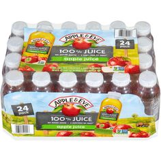 apples and juice are displayed on display in plastic bottles, with labels for apple & eve