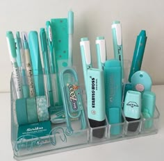 a clear container filled with lots of different types of toothbrushes and other items