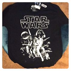 a star wars t - shirt is laying on the floor