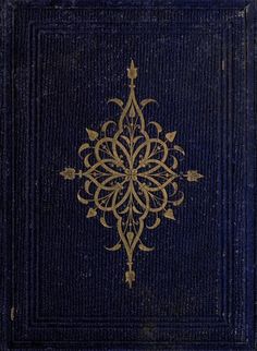 an old blue book with gold designs on it