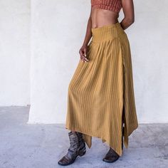 The IDIS Abby Skirt in Tumeric is a Mid rise skirt with high side splits and smocking in the back creating an elasticised waiste band for extra comfort.Made from a medium weight woven Rayon.Part of the Graceful Rebellion Range.SIZE GUIDE XS: bust 76-82 cm | waist 64-70 cm | hips 78-84 cmS: bust 82-84 cm | waist 70-76 cm | hips 84-90 cmM: bust 84-88 cm | waist 76-82 cm | hips 90-96 cmL: bust 94-100 cm | waist 82-88 cm | hips 96-102 cmXL: bust 100-106 cm | waist 88-104 cm | hips 102-108 cmDELIVERY Casual Skirt Bottoms With Side Slits, Asymmetrical Skirt With Side Slits For Summer, Summer Asymmetrical Skirt With Side Slits, Bohemian Pleated Relaxed Fit Maxi Skirt, Asymmetrical Skirt With Side Slits For Spring, Relaxed Midi Skirt With Side Slits, Spring Asymmetrical Skirt With Side Slits, Spring Long Skirt With Side Slits, Casual Relaxed Maxi Skirt With Side Slits