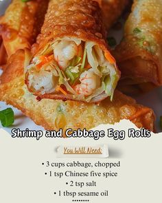 shrimp and cabbage egg rolls on a white plate