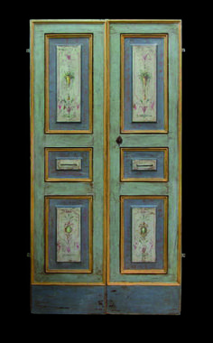 an old wooden door with paintings on it