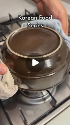 a person cleaning a stove top with a cloth on it and the words korean food series written below