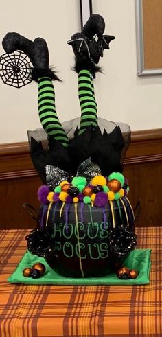 a cake decorated with black and green decorations