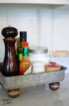 a metal container filled with lots of different types of condiments