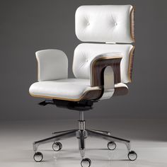 an office chair with white leather upholstered on the back