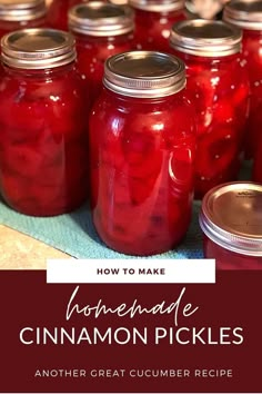 jars filled with homemade cinnamon pickles sitting on top of a table