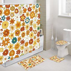 the bathroom is decorated with colorful flowers and white tile flooring, along with matching rugs