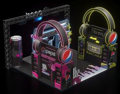 an illuminated display with headphones, speakers and music equipment in the shape of a box