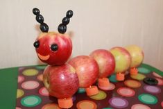 a very cute looking toy made to look like a caterpillar on a table