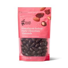 chocolate almonds with himalayan salted dark chocolate almonds in bag on white background