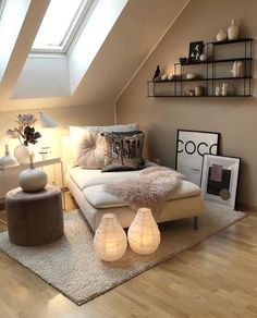 an instagram photo of a bedroom with white furniture and decor on the walls,