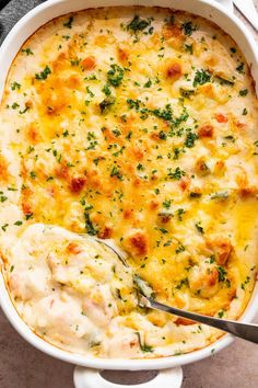 a casserole dish with chicken and cheese