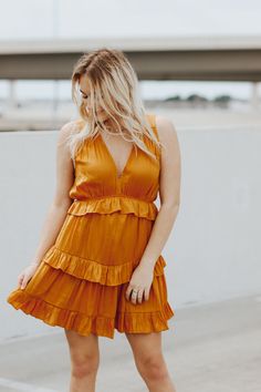 Sleeveless, ruffled, tiered dress.Maddie is wearing a size smallSkirt portion is linedSize Chart:Small: Waist: 26 in. Bust: 34 in.Medium: Waist: 28 in. Bust: 36 in. Large: Waist: 30 in. Bust: 38 in. This item is final sale. Tiered Ruffle Dress For Date Night, Tiered Ruffled Mini Dress For Date Night, Date Night Tiered Mini Dress With Ruffle Hem, Sleeveless Tiered Dress For Day Out, Flirty Tiered Ruffle Dress For Day Out, Ruffled Tiered Skirt Sundress, Tiered Dress With Layered Hem For Day Out, Tiered Skirt Sundress With Ruffle Hem, Tiered Skirt Mini Dress With Ruffle Hem