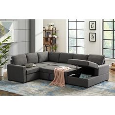 a living room with a gray sectional couch