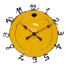 a yellow clock with black hands and numbers on it