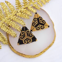 These gold and black earrings are made of high quality Japanese beads. They are suitable for both casual and evening looks. They are sure to make you stand out from the crowd.  The triangle earrings have an unusual design - a yin-yang. This design is very unusual and elegant. They shimmer beautifully. A pendant and bracelet with this pattern can be purchased in a set with earrings. Buy these handmade earrings as a gift for your mom, daughter, sister or friend. The earrings are packaged in a beau Gift Black Beaded Earrings With Gold Beads, Gold Drop Earrings With Black Beads, Gold Beaded Earrings With Black Beads As Gift, Black Earrings With Gold Beads As Gift, Gold Beaded Earrings With Black Beads For Party, Gold Beaded Earrings With Colorful Beads As Gift, Elegant Black Earrings With Colorful Beads, Gold Earrings With Colorful Beads For Party, Handmade Earrings Beaded