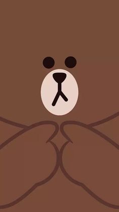 a brown teddy bear with black eyes and hands on it's chest, looking at the camera