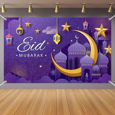 an empty room with wooden floors and purple wallpaper that says eid mubarak