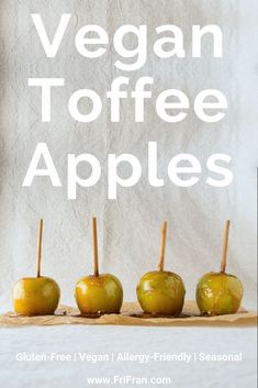 four green apples with toothpicks in them and the words vegan toffee apples