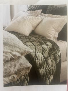 a black and white photo of a bed with pillows