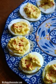 deviled eggs on a blue and white plate