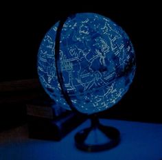 an illuminated globe sitting on top of a table