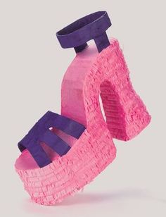 a pair of pink and purple shoes made out of paper