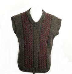 Classic 1970s tank top / vest from British Wool. Made in UK from 100 % wool in a natural brown with red decorative stitches.  It is soft, chunky knit and medium weight.  Features V neck and ribbing at neck, sleeves and hem.   Freshly washed in eco products and in excellent condition.  Great accessory and highly evocative of time. Size L Flat Measurements :  Chest                         44 inches / 112 cm    Hips                            40 inches / 102 cm    Back Length              27 inches Retro Fitted Brown Sweater Vest, 70s Sweater Vest, Retro Brown Cotton Vest, Vintage Sleeveless Wool Sweater Vest, Brown Knit V-neck Vest, V Neck Tank Top, Mens Vests, Vest Outfits, Clothing Labels