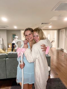 two women in bunny costumes hugging each other