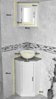 a bathroom with measurements for the sink and cabinet in front of it's mirror