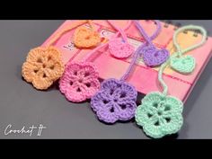 small crocheted flowers on a pink book