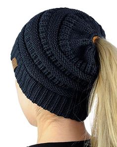 a woman with blonde hair wearing a ponytail in a knitted beanie hat, back view