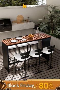 an outdoor dining table with four chairs and a grill in the back ground next to it