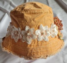 A fun summer, fall hat complete with a bow,  flowers and pretty broaches.  Great for the beach or a day or evening on the town that makes a statement. Free shipping from my store on orders over $35. Whimsical Short Brim Beach Hat, Handmade Summer Sun Hat For Garden Party, Whimsical Brimmed Sun Hat For Beach, Whimsical Sun Hat For Spring Beach Outings, Whimsical Fedora For Beach, Cute Beach Sun Hat, Handmade Flower Hats For Summer, Whimsical Wide Brim Bucket Hat For Summer, Whimsical Beach Hat For Spring