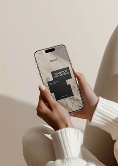 a woman is holding her phone up to show the screen with an ad on it